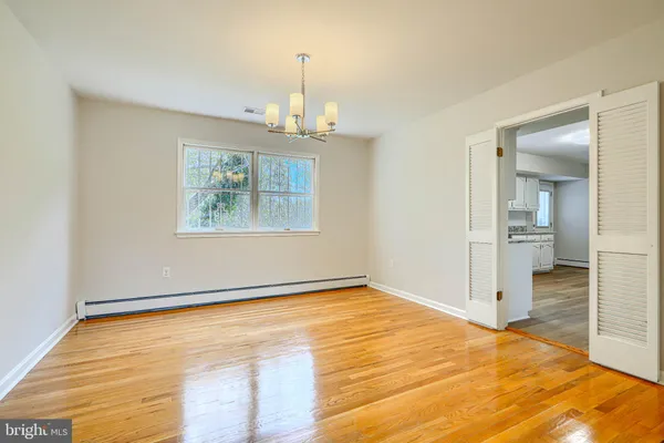 a kitchen with granite countertop a sink stainless steel appliances and cabinets