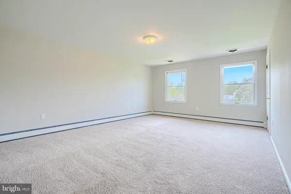 a view of a room with wooden floor and stairs