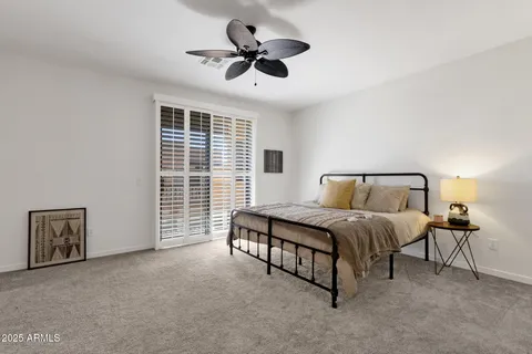 a view of a porch with furniture and a yard