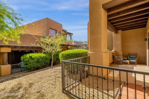 a view of a chair and table in the balcony