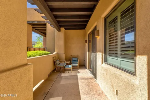 a view of swimming pool with outdoor seating