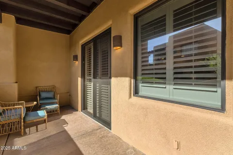 a view of a chairs and table in the patio