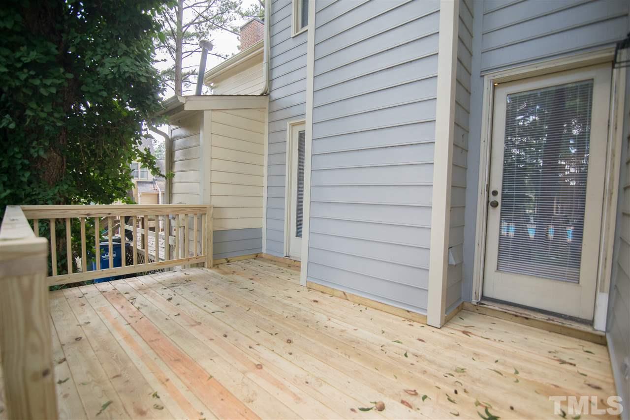 5624 Darrow Drive Raleigh, NC 27612 - Photo 19 of 21 Newly constructed deck is the perfect size for a large table and chairs.