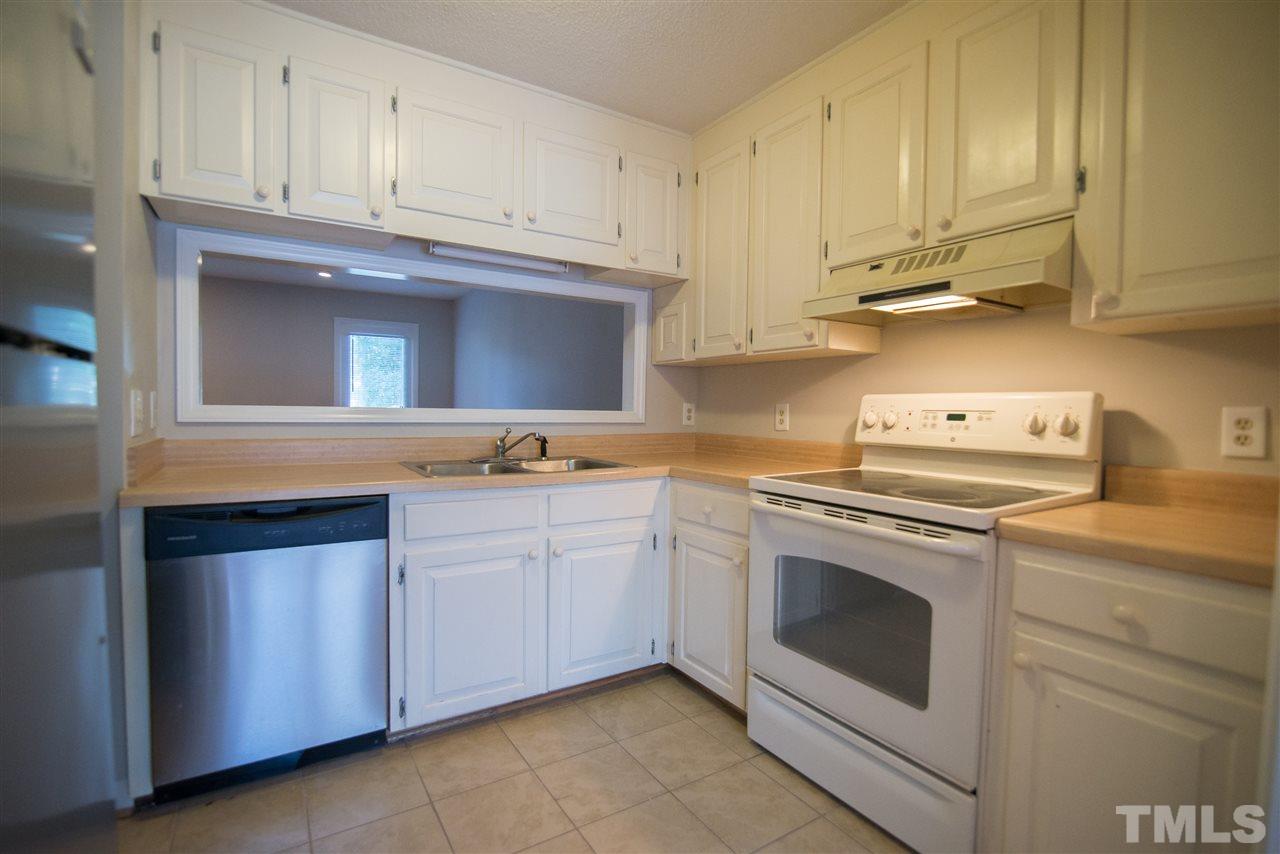 5624 Darrow Drive Raleigh, NC 27612 - Photo 4 of 21 This nicely appointed kitchen has a great peak through window for a more open feel.