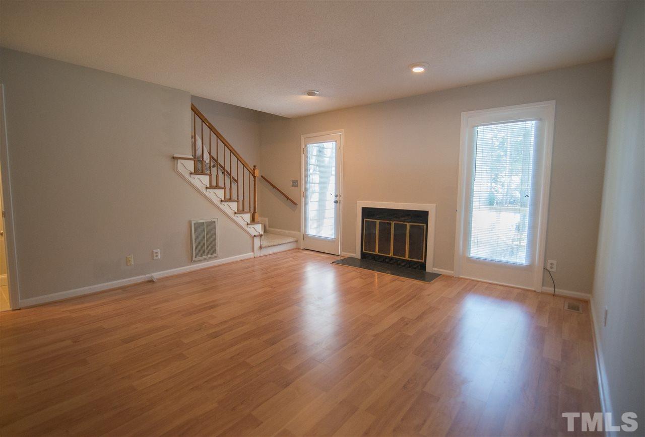 5624 Darrow Drive Raleigh, NC 27612 - Photo 9 of 21 Well lit, and large~ this great room really lives up to its name! It won't be long before temperatures drop and you'll be able to cozy up to a nice fire!