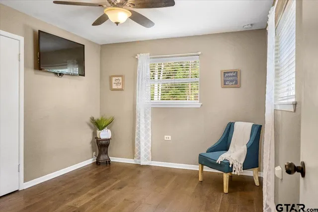a view of livingroom with hardwood floor and a flat screen tv