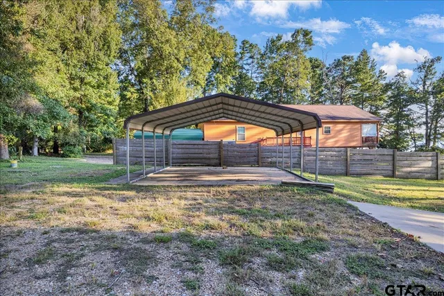 a view of pool with a yard