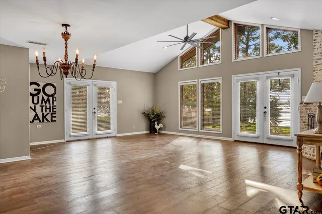 a view of a big room with wooden floor windows and livingroom
