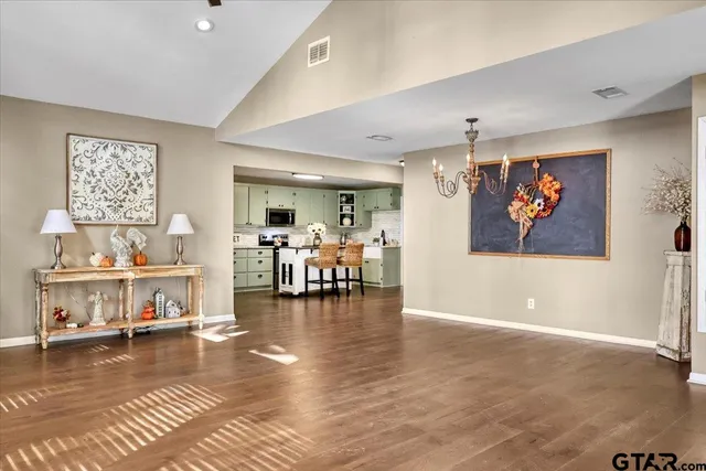 a living room with furniture and a table