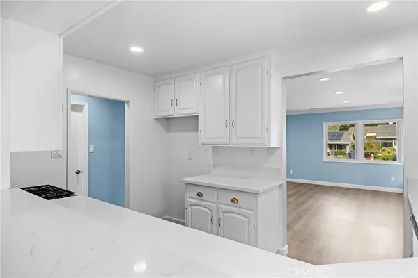 a kitchen with a refrigerator and window