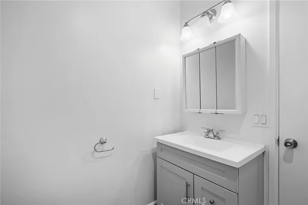 a bathroom with a sink and mirror