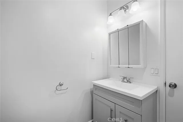 a bathroom with a sink and mirror