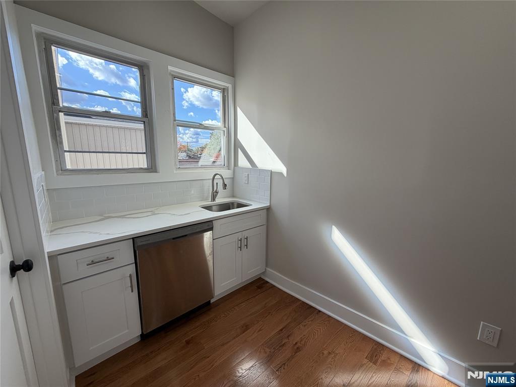24-30 Pleasant, Unit 2 EAST Maywood, NJ 07607 - Photo 5 of 13 a kitchen with sink and cabinets