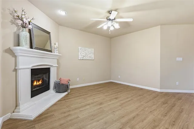 a view of an empty room with a fireplace