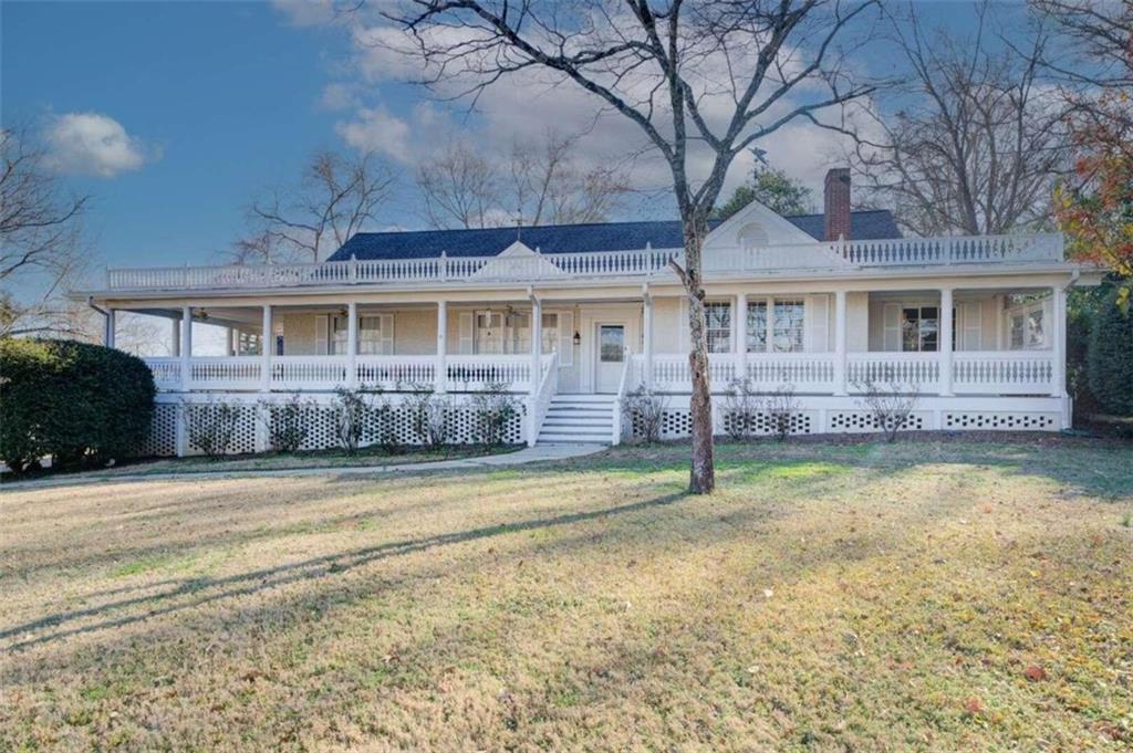 3136 Monticello Street Southwest Covington, GA 30014 - Photo 1 of 1 a front view of a house with a yard