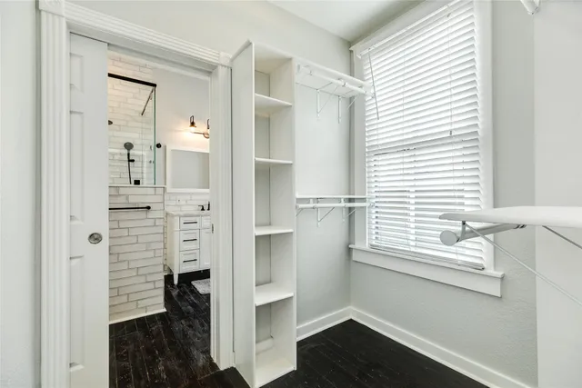 a bathroom with a shower and a sink