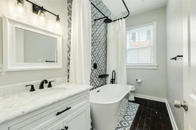 a bathroom with a bathtub and a shower