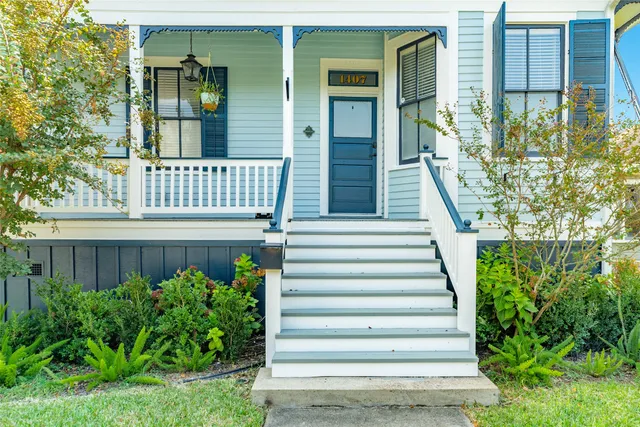 a view of a house with a small yard