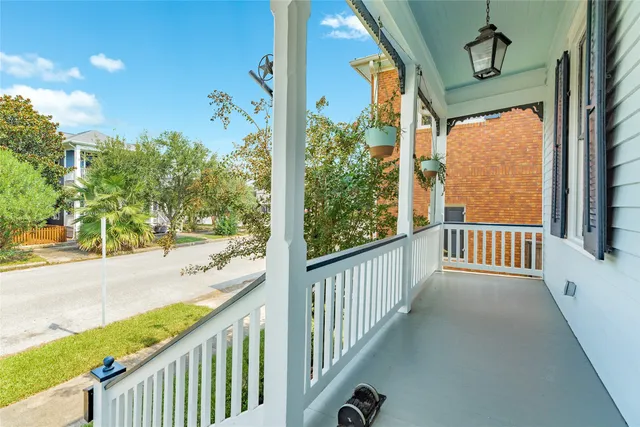 a view of a porch with wooden floor and roof