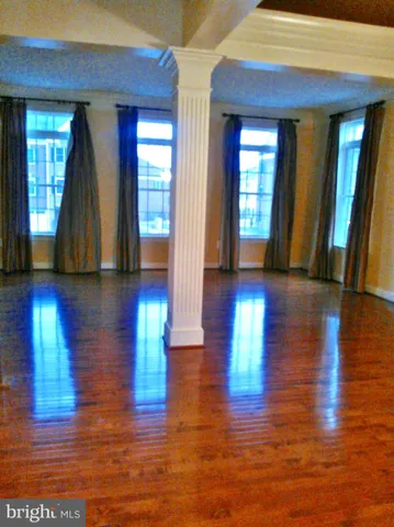 a view of gallery with wooden floor