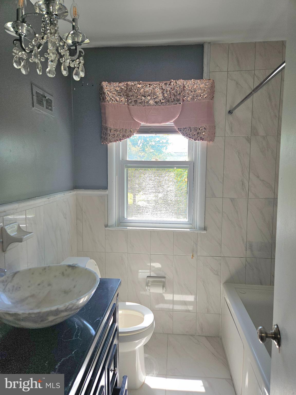 148 Church Road Elkins Park, PA 19027 - Photo 26 of 33 a bathroom with a toilet a sink and bathtub