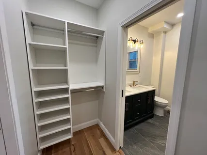 a bathroom with a sink vanity and a mirror