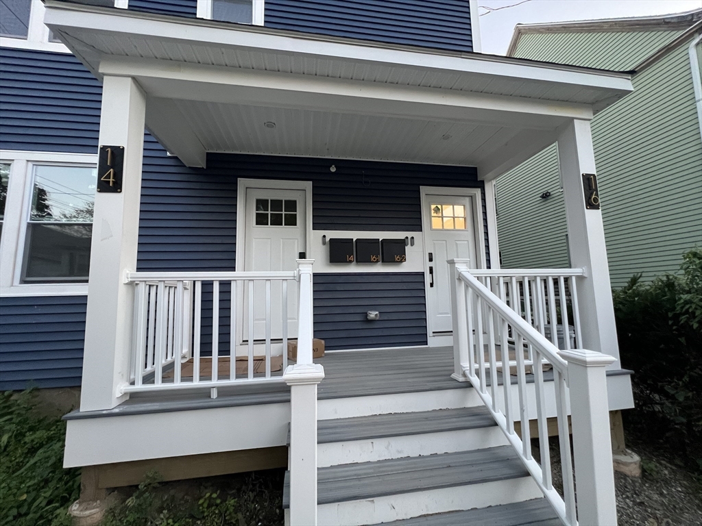 16 Harriet Street, Unit 1 Boston, MA 02135 - Photo 27 of 29 a view of a house with large windows and stairs