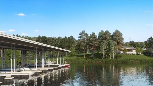 a view of house with swimming pool and outdoor seating