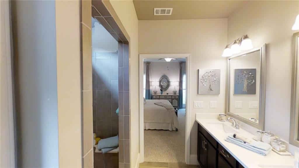 1971 Assembly (lot 164) Circle Gainesville, GA 30501 - Photo 8 of 12 a bathroom with a double vanity sink and a mirror