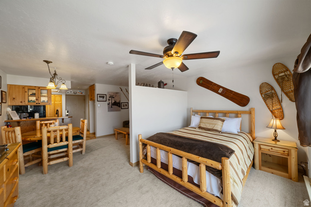 150 Ridgeview Street, Unit 117 Brian Head, UT 84719 - Photo 15 of 20 Bedroom with light colored carpet