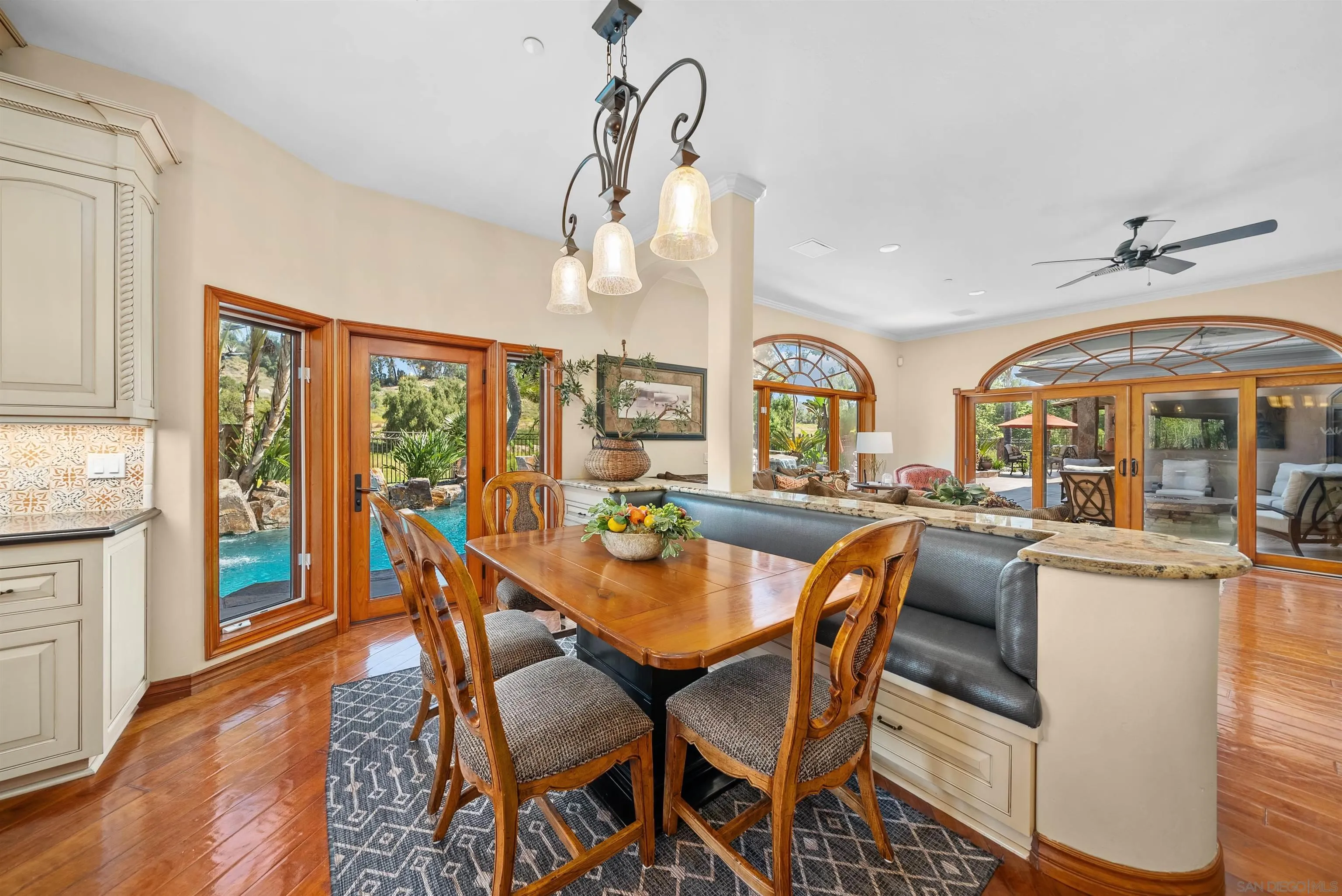 3307 Wentworth Drive Jamul, CA 91935 - Photo 15 of 75 a dining room with furniture a chandelier and wooden floor