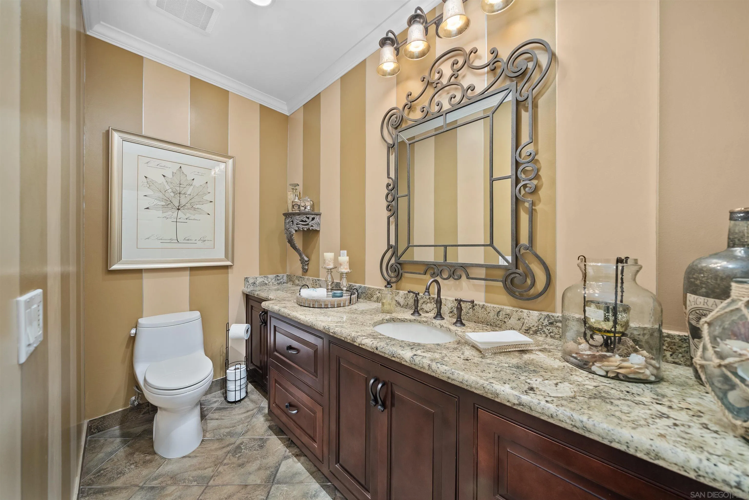 3307 Wentworth Drive Jamul, CA 91935 - Photo 19 of 75 a bathroom with a granite countertop toilet a sink and a mirror
