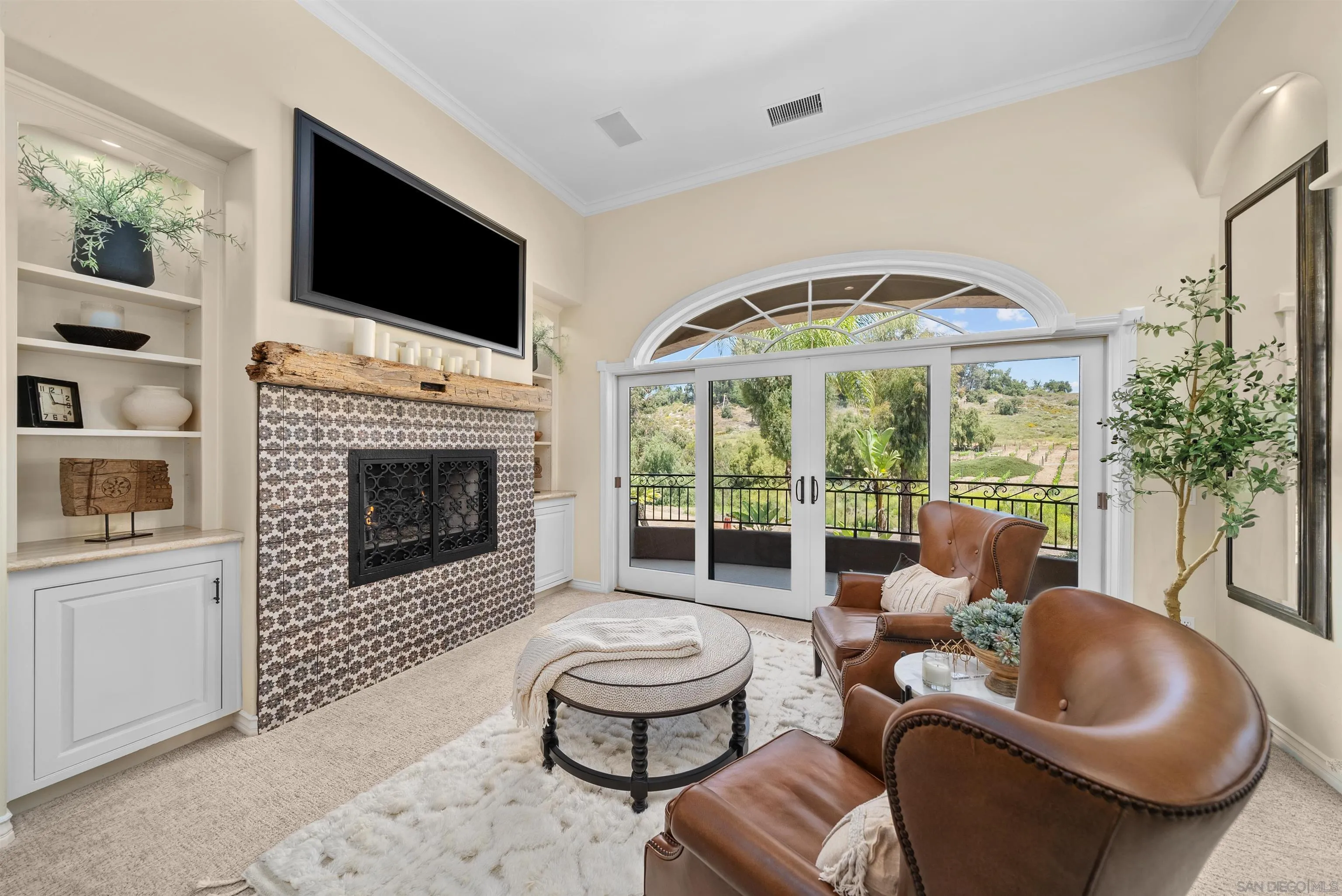 3307 Wentworth Drive Jamul, CA 91935 - Photo 35 of 75 a living room with furniture a flat screen tv and a fireplace
