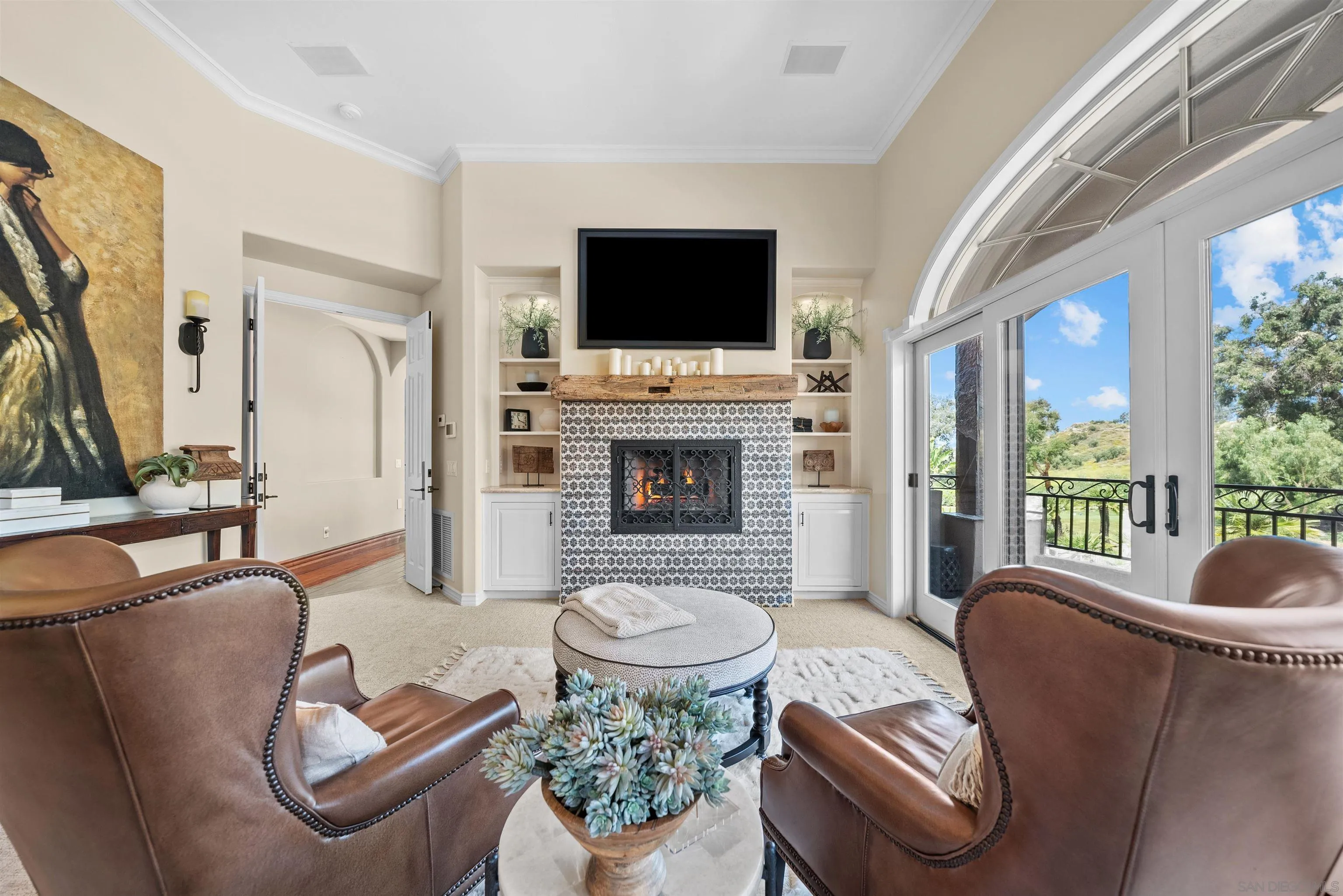 3307 Wentworth Drive Jamul, CA 91935 - Photo 38 of 75 a living room with furniture a flat screen tv and a fireplace