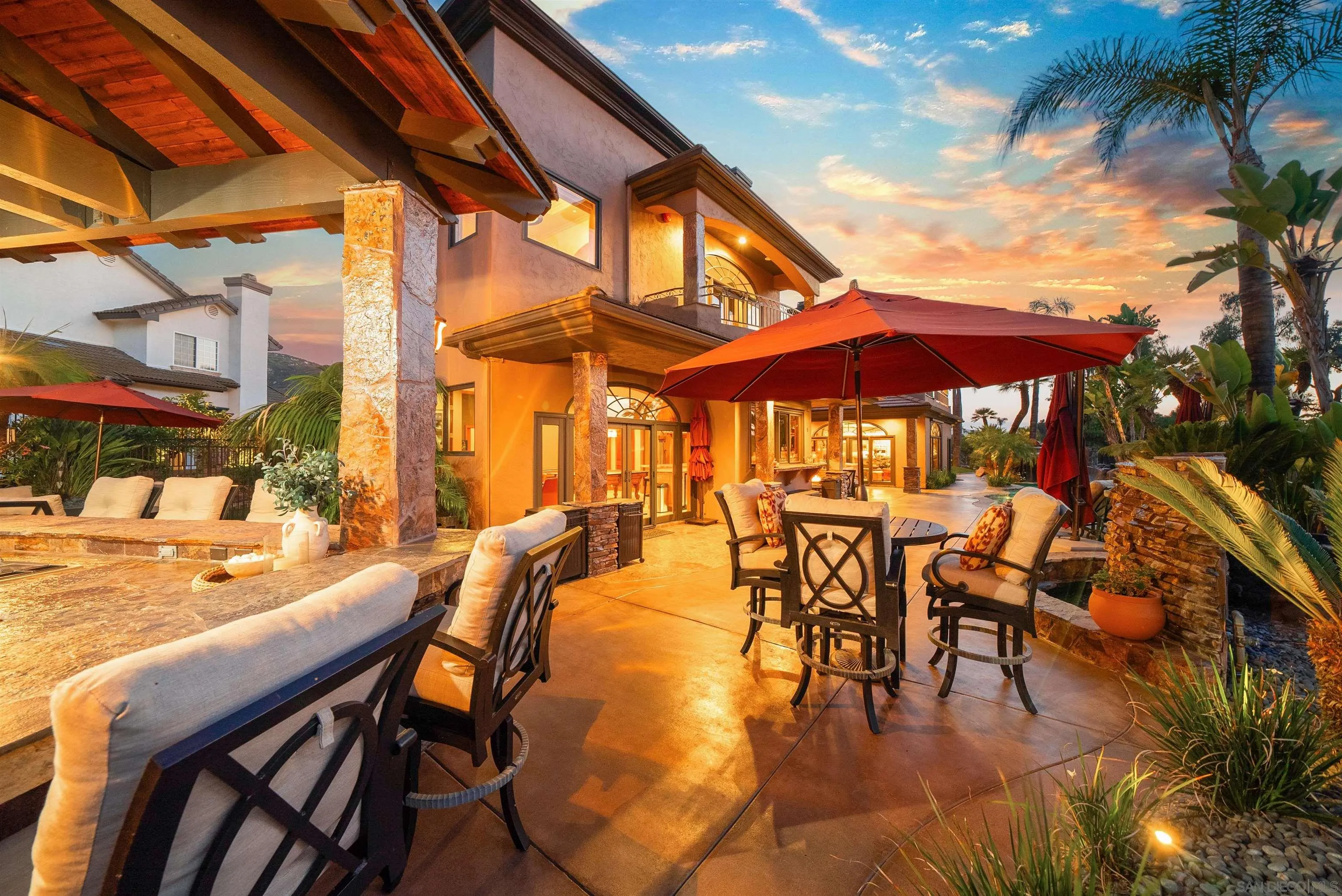3307 Wentworth Drive Jamul, CA 91935 - Photo 66 of 75 a view of a patio with a table and chairs under an umbrella