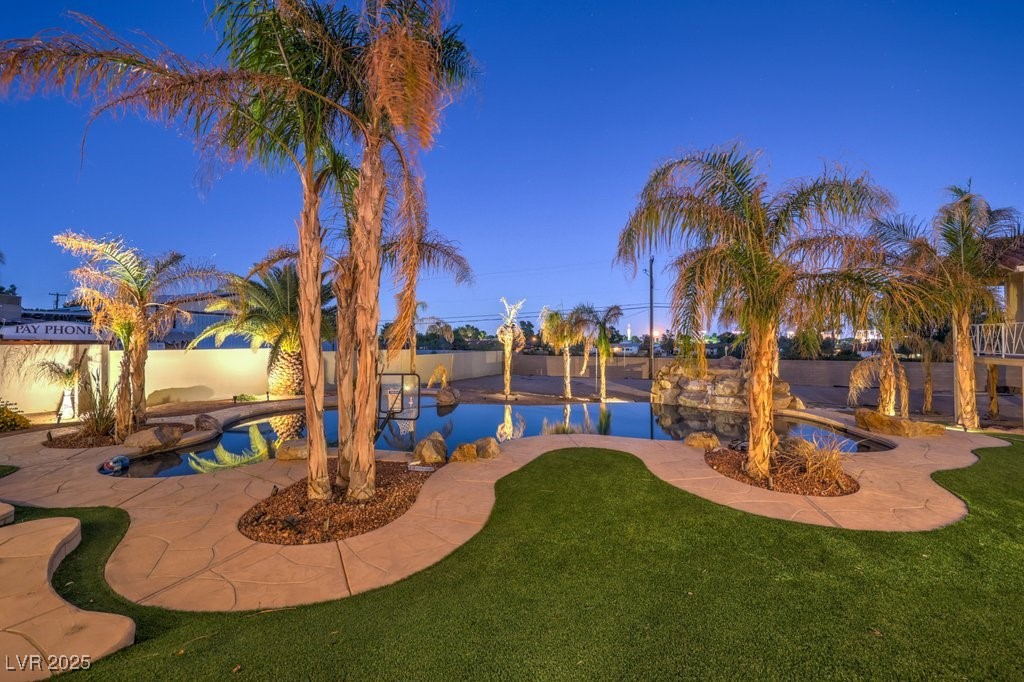 2780 El Camino Road Las Vegas, NV 89146 - Photo 13 of 91 Pool at dusk featuring a patio