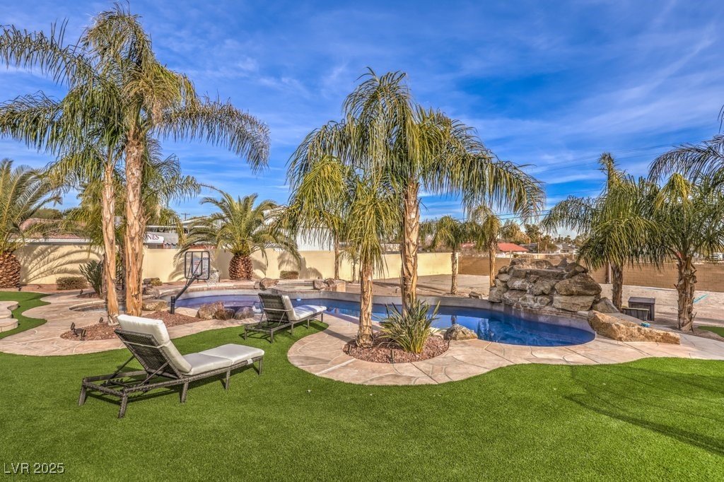 2780 El Camino Road Las Vegas, NV 89146 - Photo 76 of 91 Swimming pool with a patio area and a lawn
