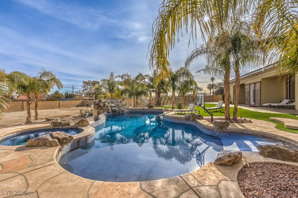 2780 El Camino Road Las Vegas, NV 89146 - Photo 77 of 91 View of pool featuring a patio, a fenced backyard, and a pool with connected hot tub