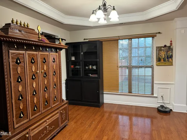 a view of a room with wooden floor
