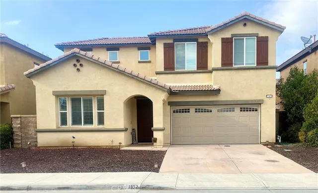 a front view of a house with a garage