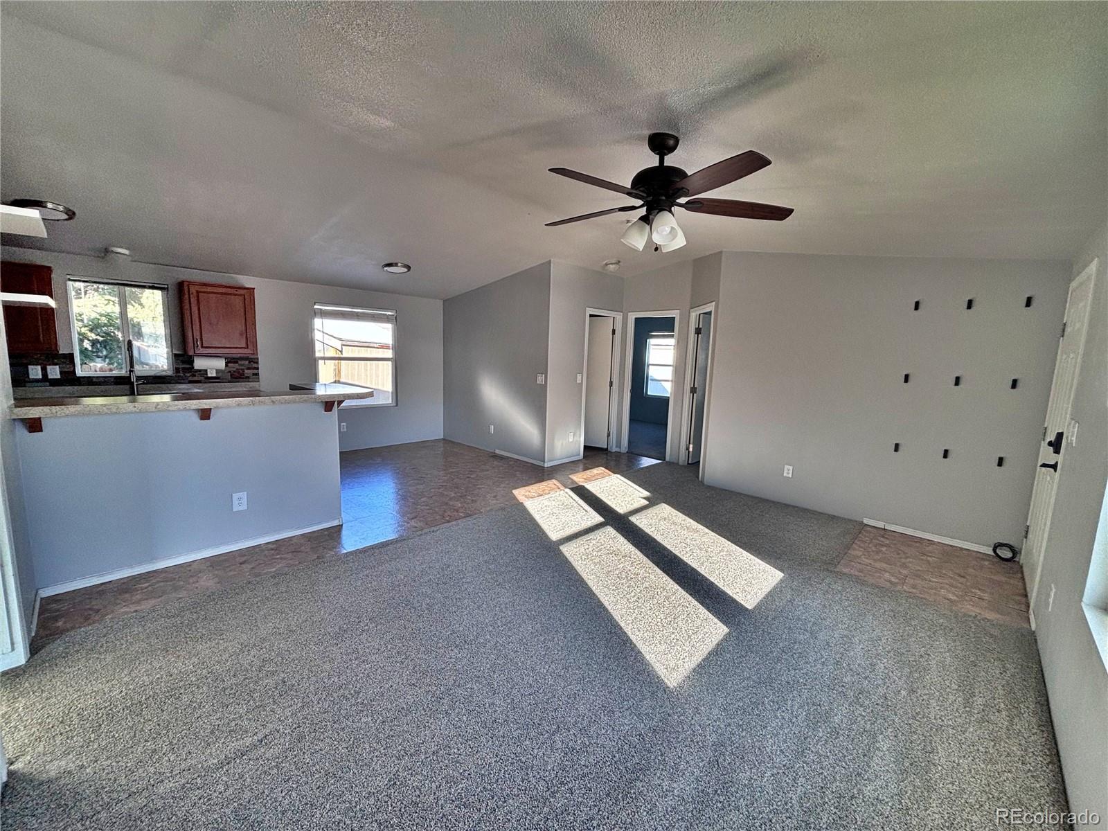 155 A Street Golden, CO 80401 - Photo 11 of 49 a living room with furniture and a flat screen tv