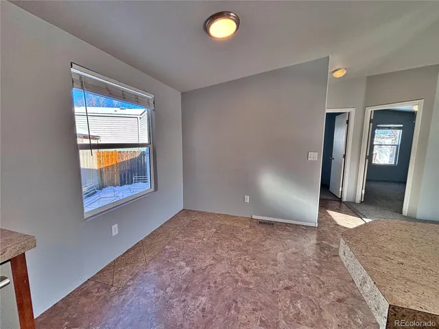 a spacious bathroom with a double vanity sink and a mirror