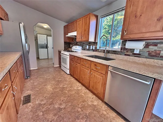 a view of cabinets and wooden floor