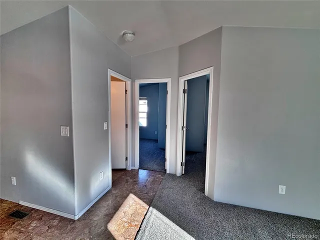 a bathroom with a toilet a sink and a mirror
