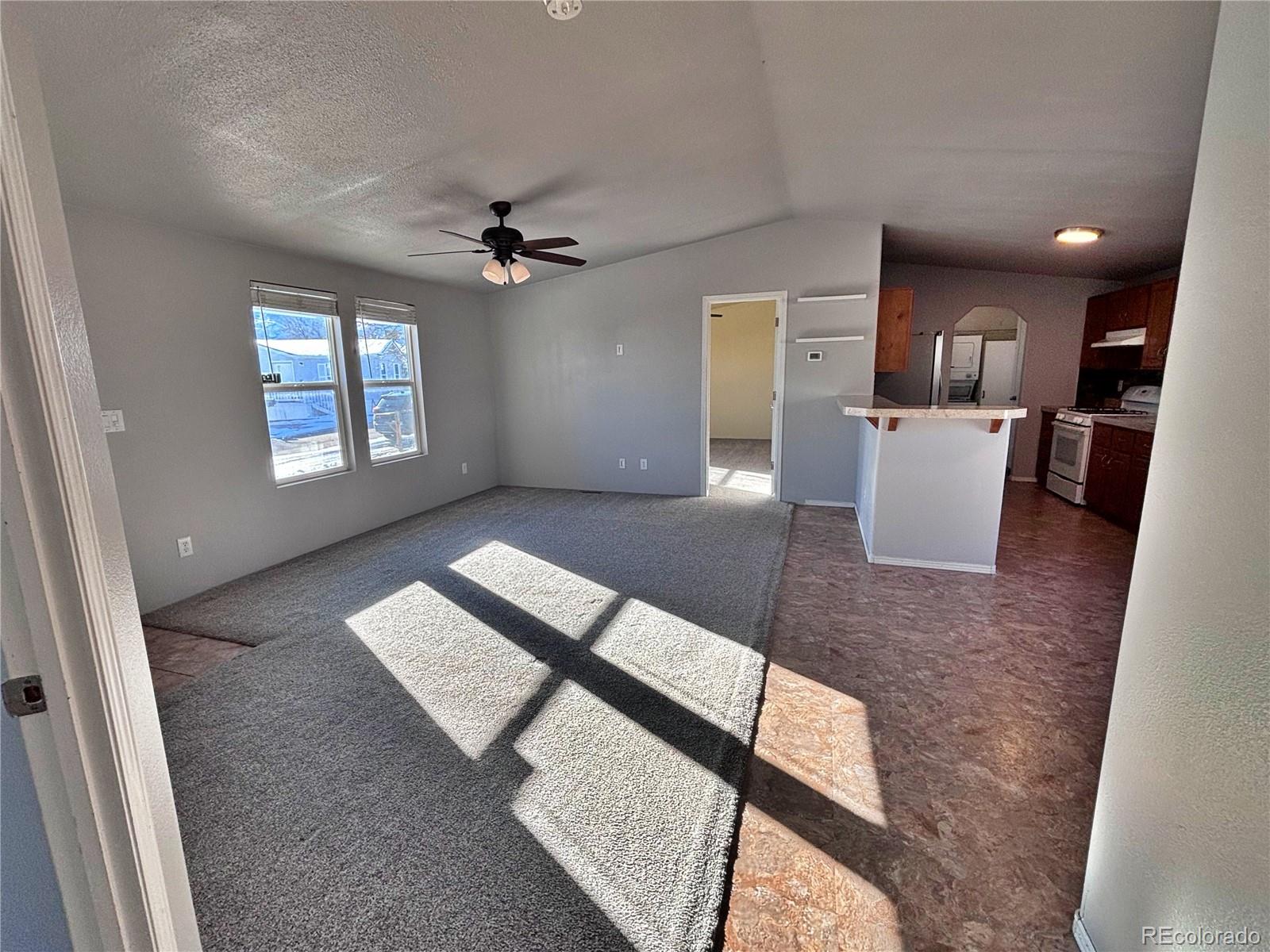155 A Street Golden, CO 80401 - Photo 36 of 49 wooden floor with kitchen view and a window