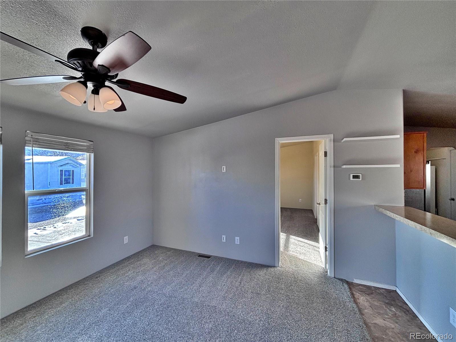 155 A Street Golden, CO 80401 - Photo 37 of 49 a view of a livingroom with a ceiling fan and window