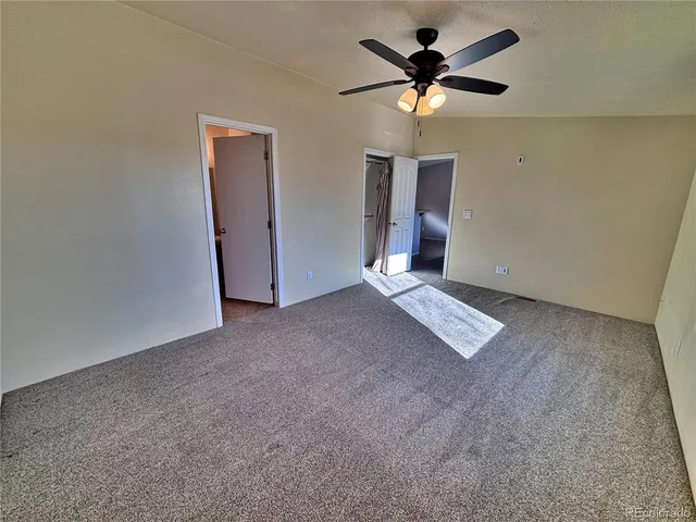 a bathroom with a sink and a granite countertop sink