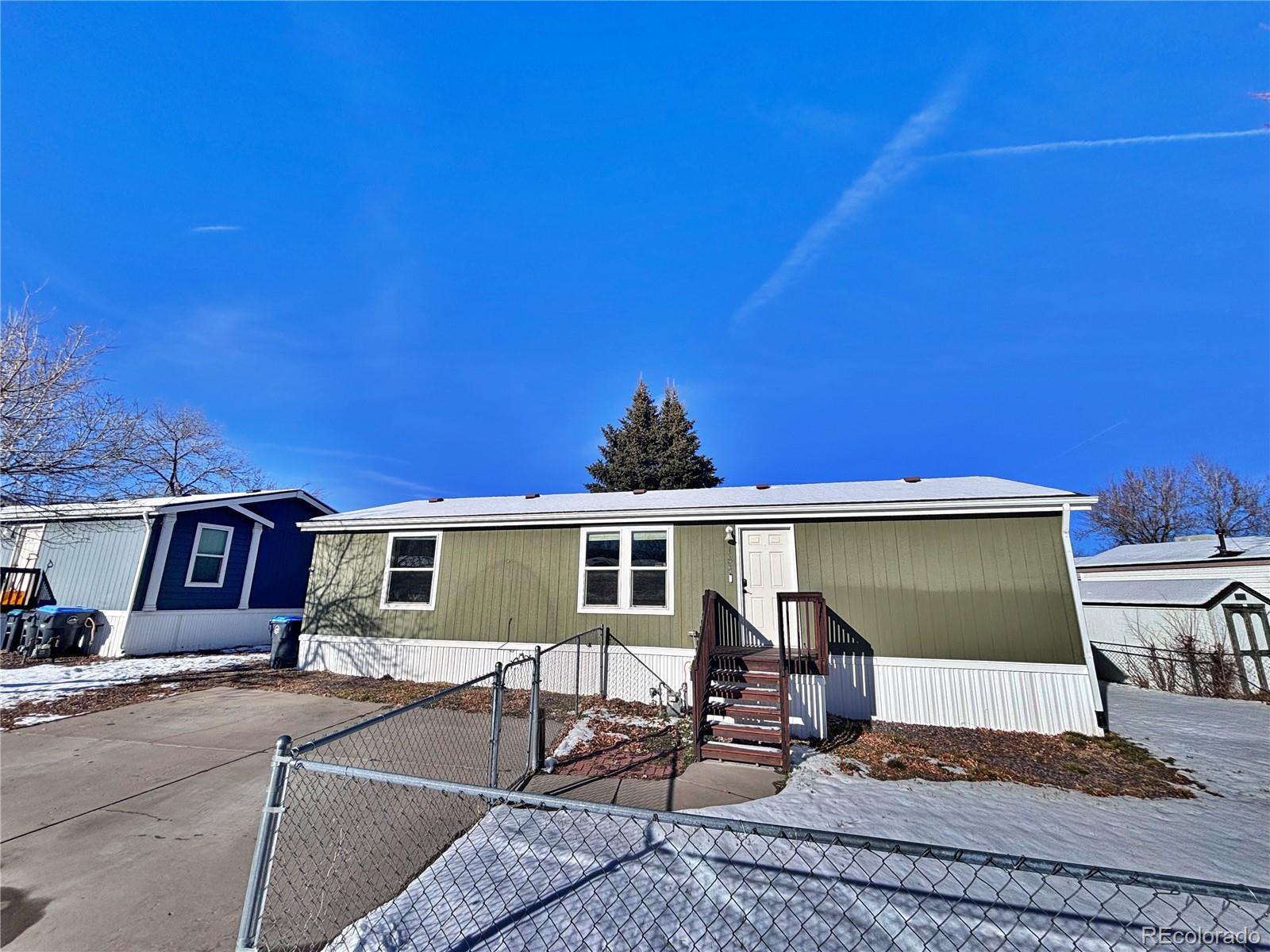 155 A Street Golden, CO 80401 - Photo 4 of 49 a view of a patio with table and chairs under an umbrella
