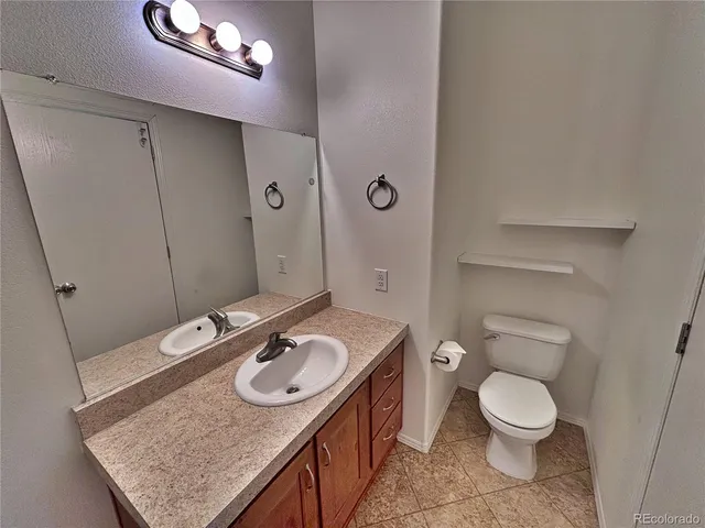a hallway with sliding door and wooden floor