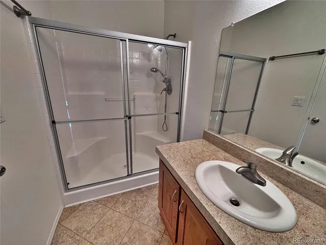 a view of a deck with wooden floor and furniture